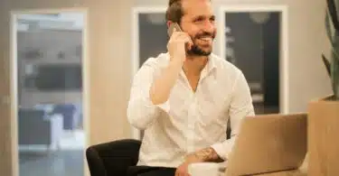 man using smartphone on chair